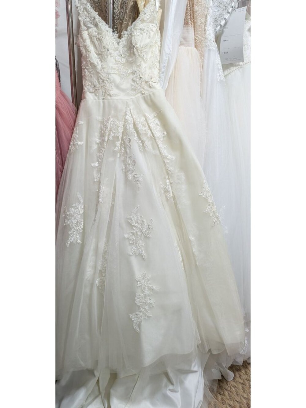 Ivory pre-owned Rosalie wedding dress v neck line long train bust34inUS2
